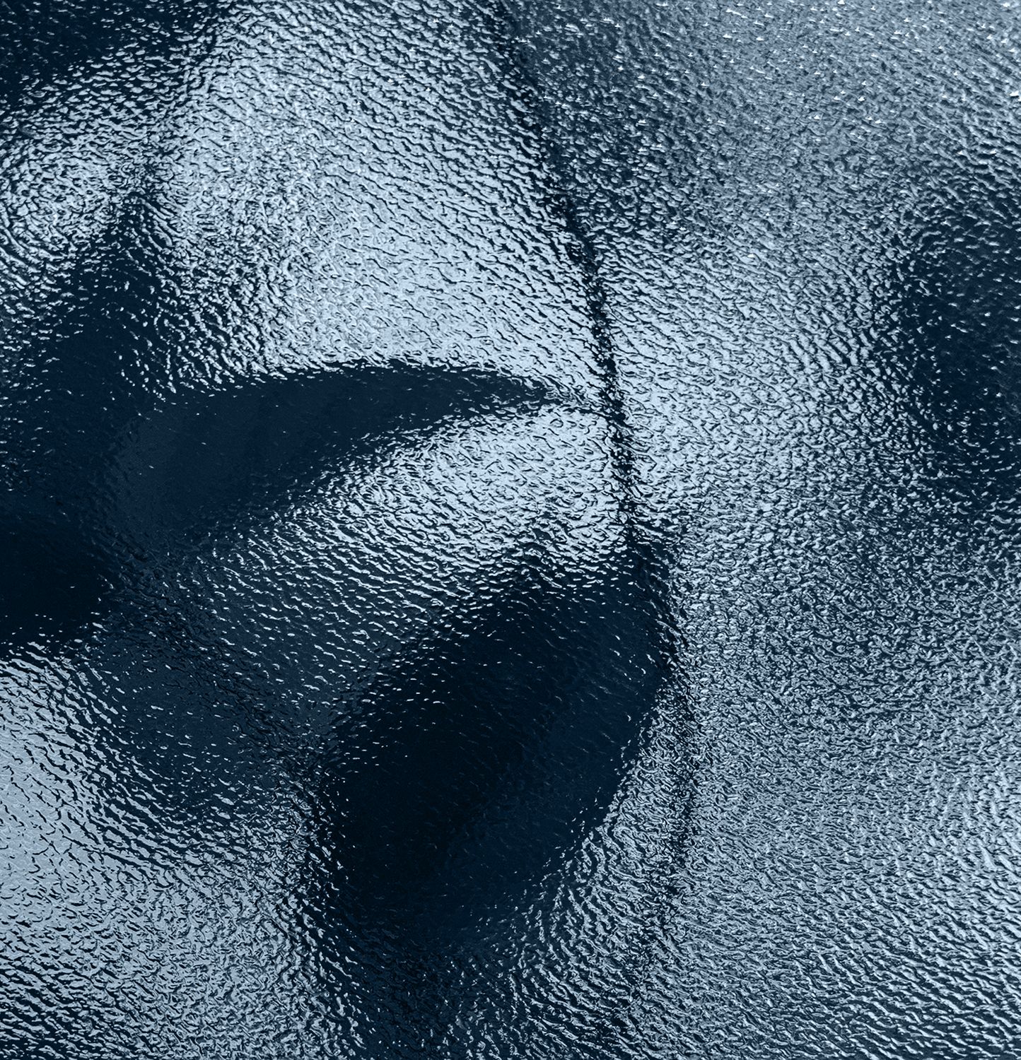 Textured blue surface with abstract shapes.