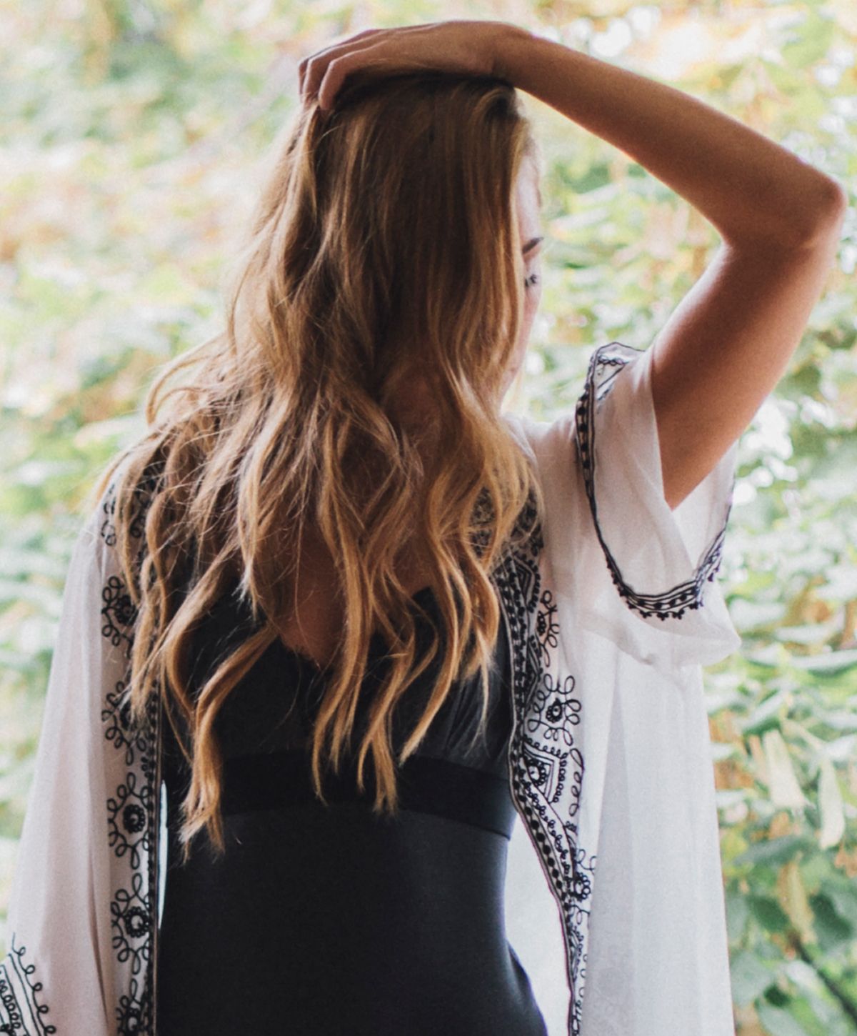 Model in casual lingerie setting indoors.