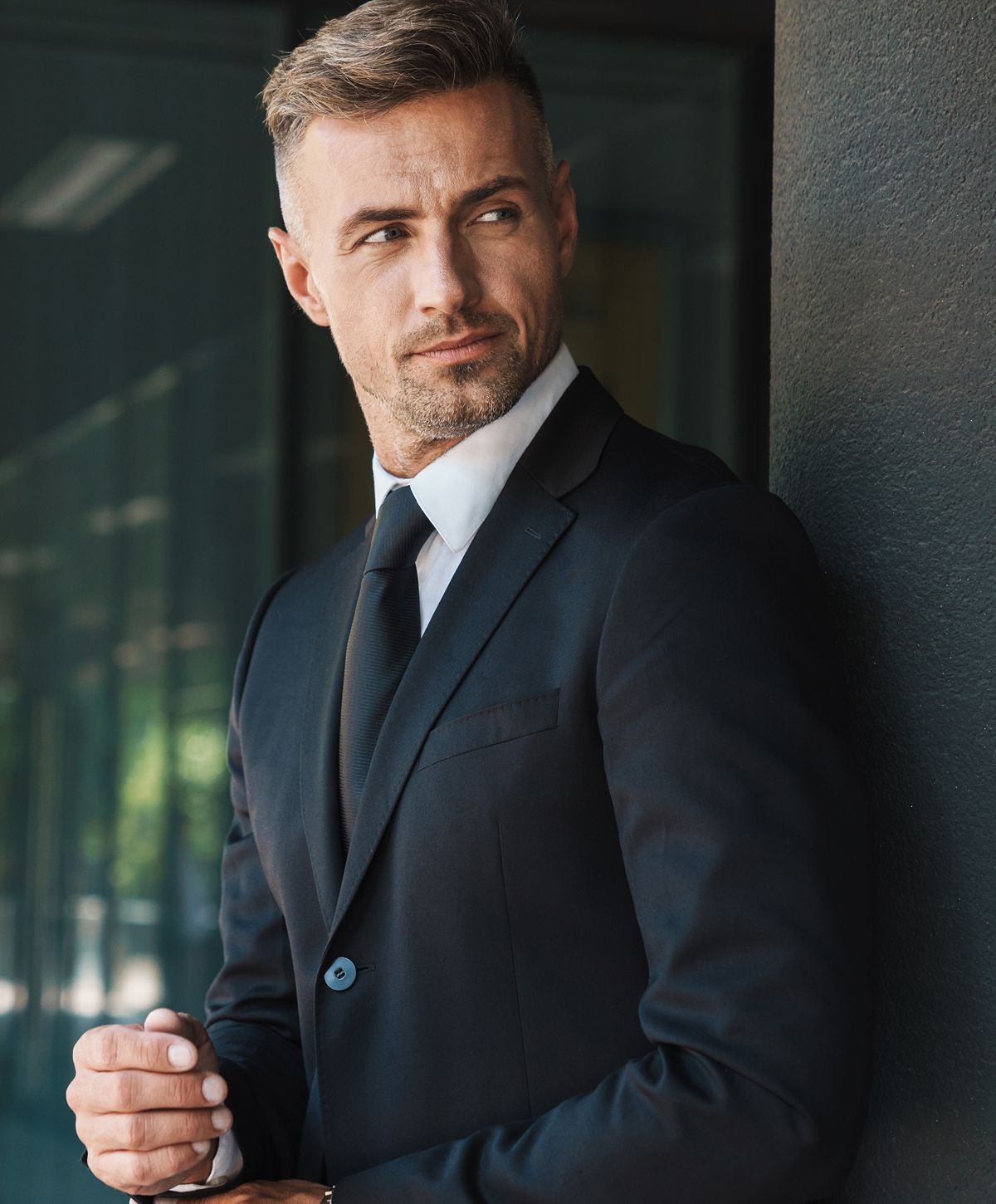 Man exercising with a focused expression indoors.