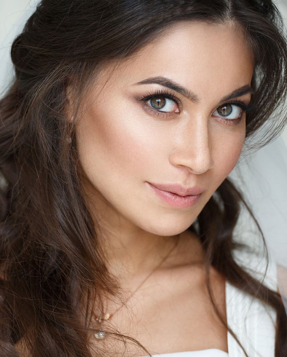 Close-up of woman with stunning features and makeup.