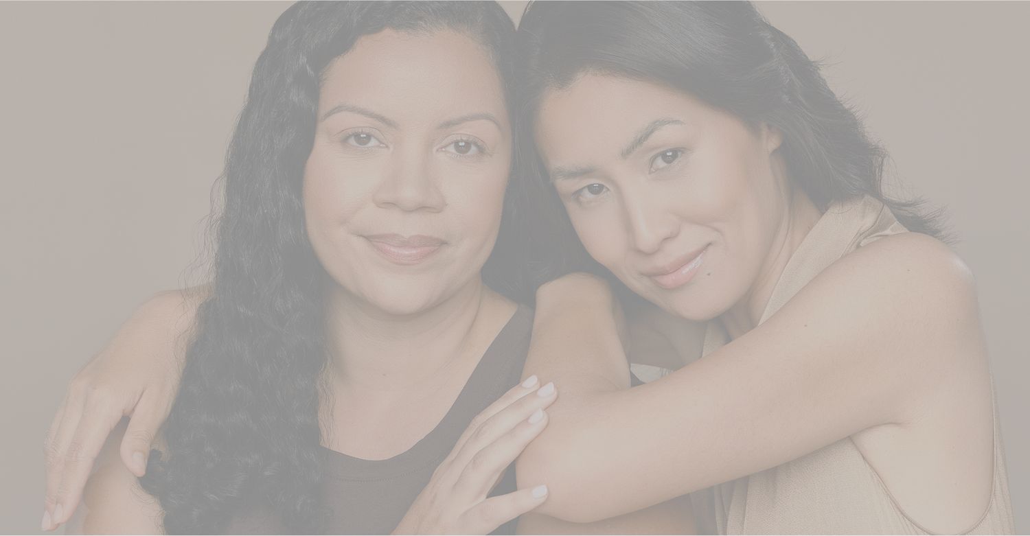 Model in light workout attire, smiling indoors.